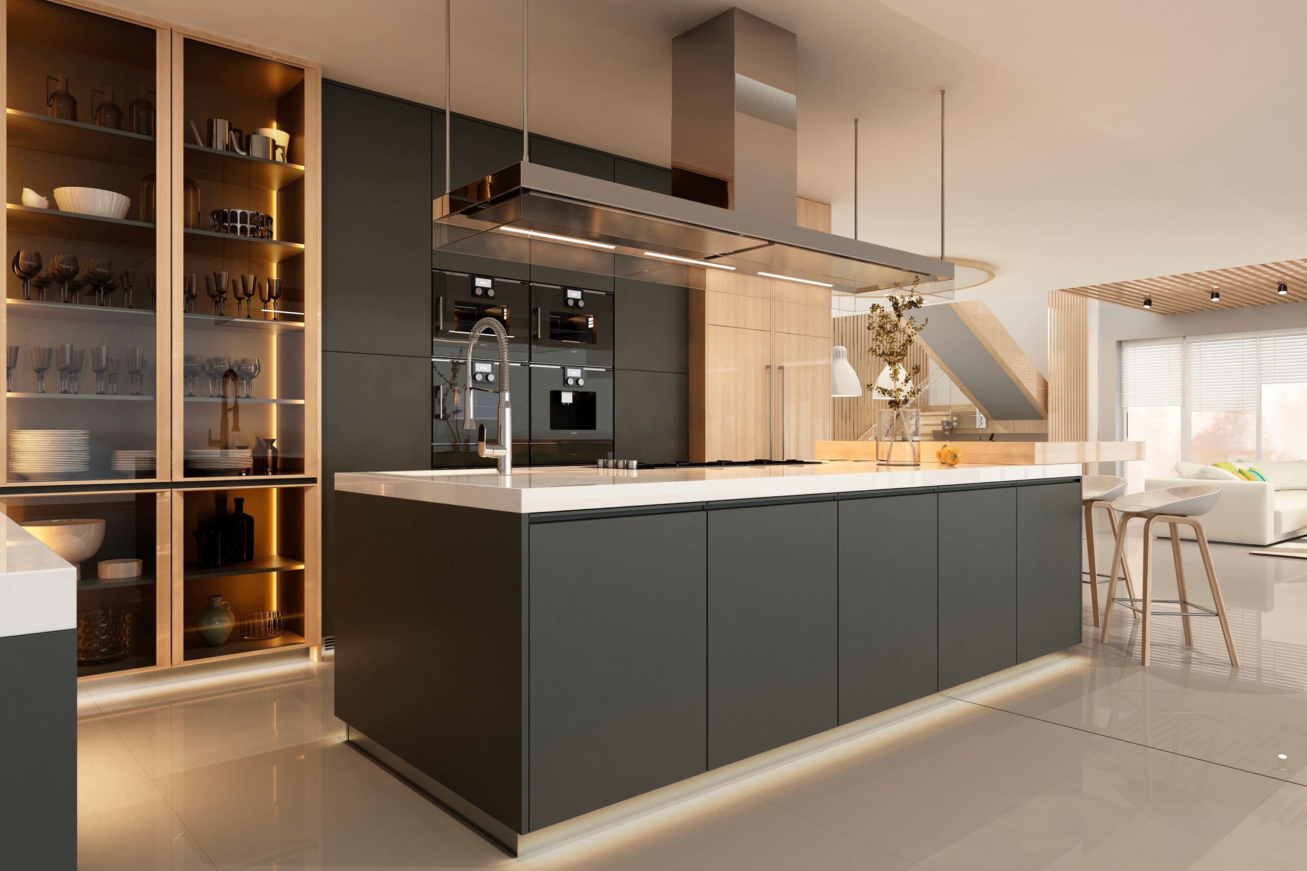 Modern kitchen with a sleek design featuring dark cabinetry, a large central island with a built-in sink, and stainless steel appliances. An open shelving unit with glassware is illuminated on the left. The space is brightened by natural light from large windows.